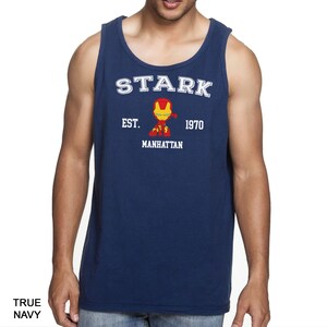A man wearing a navy blue tank top with a graphic of a character from the Marvel Cinematic Universe.