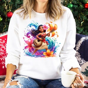 a woman sitting on a couch holding a cup of coffee