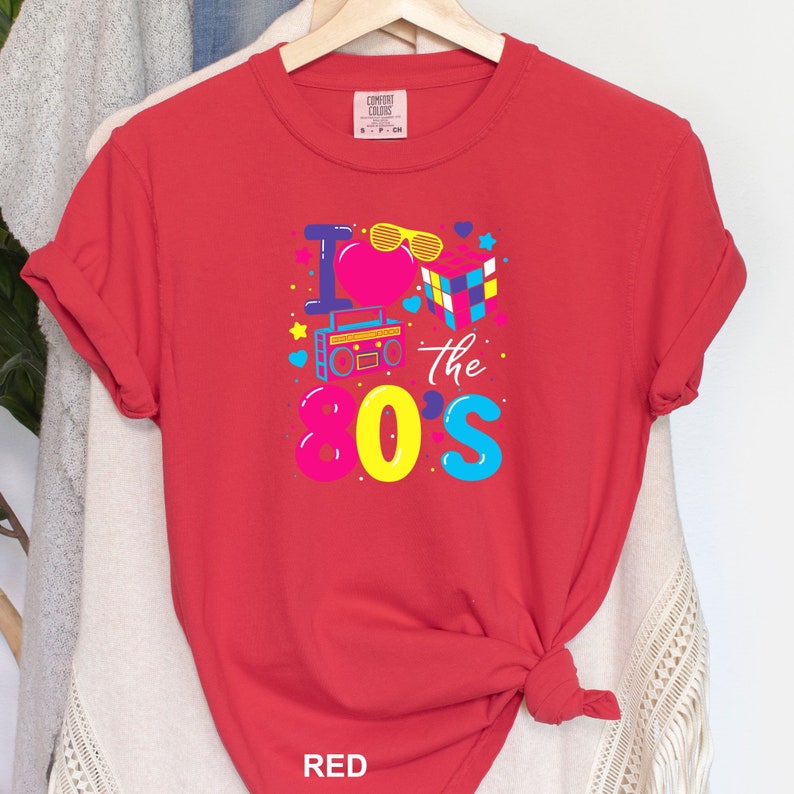 a red t - shirt with the words i love the 90's on it