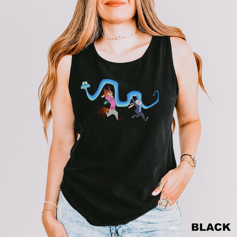 A woman wearing a black tank top with a graphic of two cartoon characters on it.
