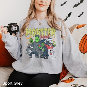 a woman sitting on a couch holding a toy