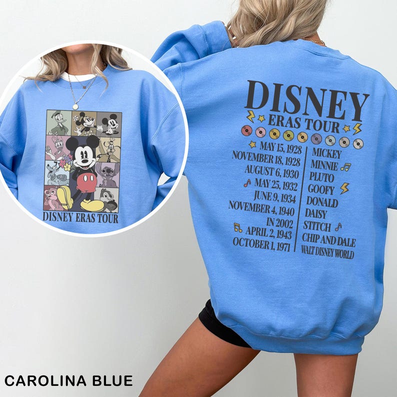 the back of a blue sweatshirt with a picture of mickey mouse on it