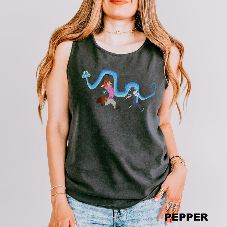 A woman wearing a gray tank top with a cartoon character design on it.