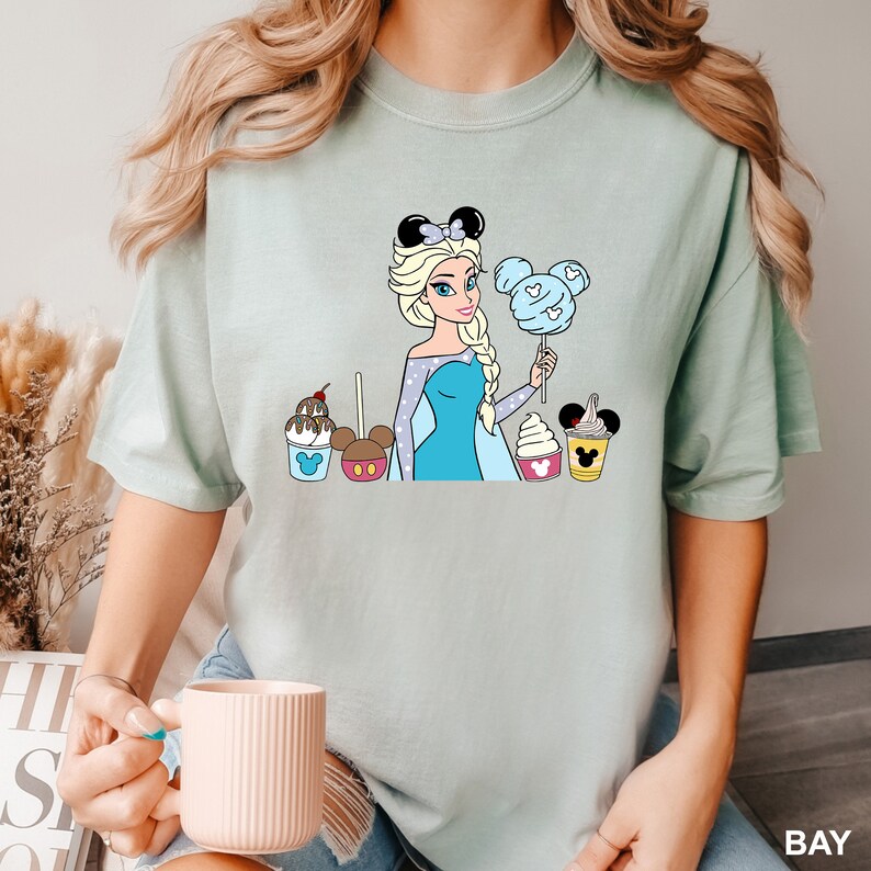 a woman is holding a cup of coffee