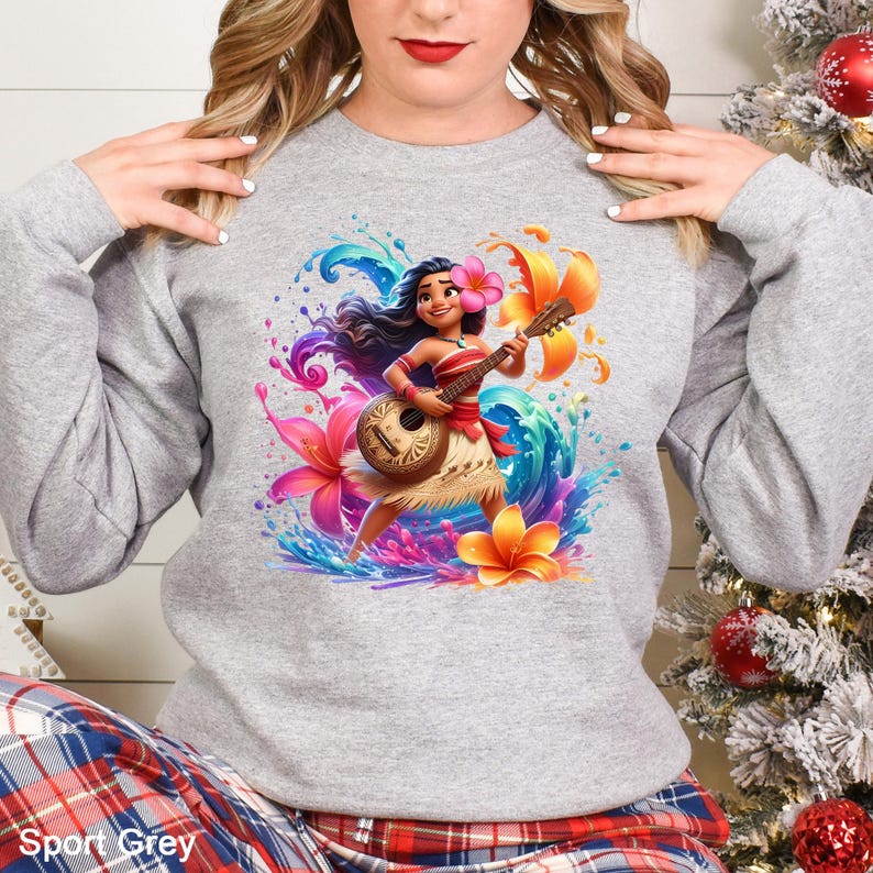 a woman wearing a sweatshirt with a hawaiian hula girl on it