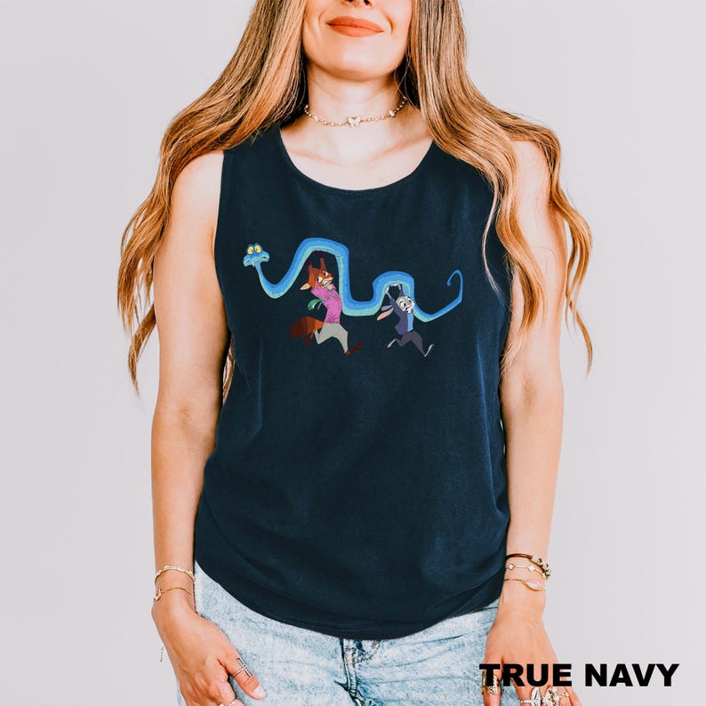 A woman wearing a navy blue tank top with a cartoon character design on it.