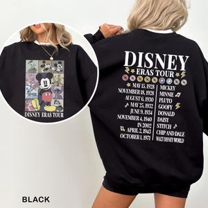 a woman wearing a black sweatshirt with a disney cast tour on it