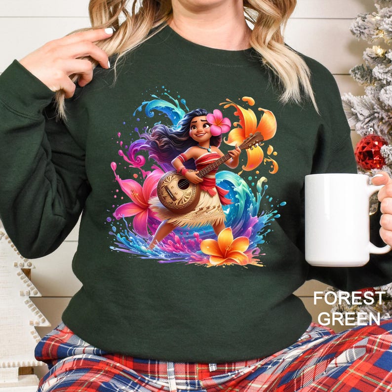 a woman is holding a coffee mug and wearing a sweatshirt