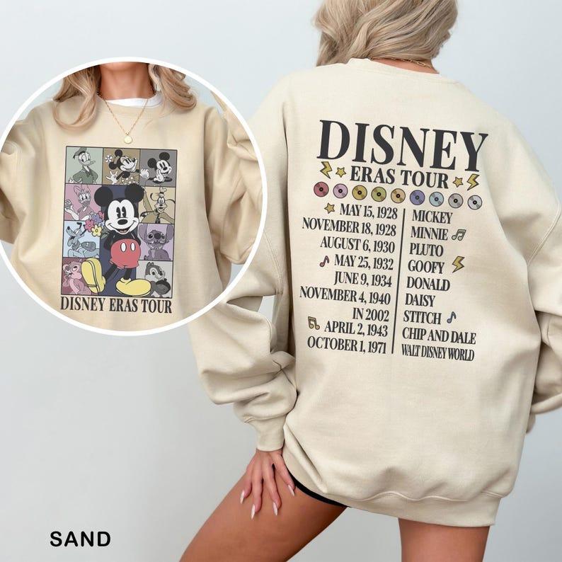 a woman wearing a mickey mouse sweatshirt and shorts