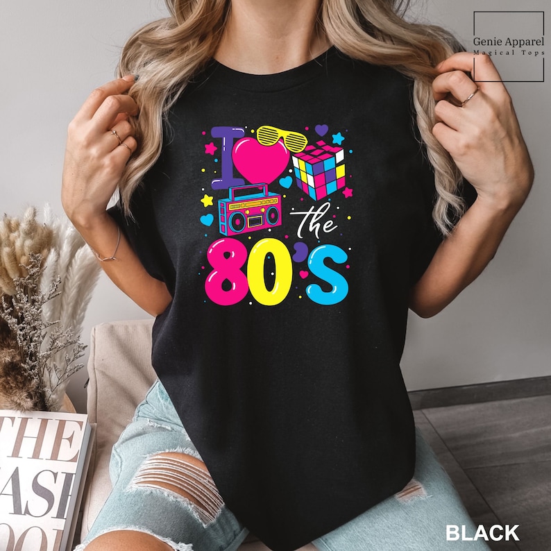 a woman wearing a black t - shirt that says i love the 80's I Love The 80's Shirt, Comfort Colors 80s Shirt, 80s Party Shirt, 80s Trip Shirt, 80s Group Shirt Retro 80s Shirt