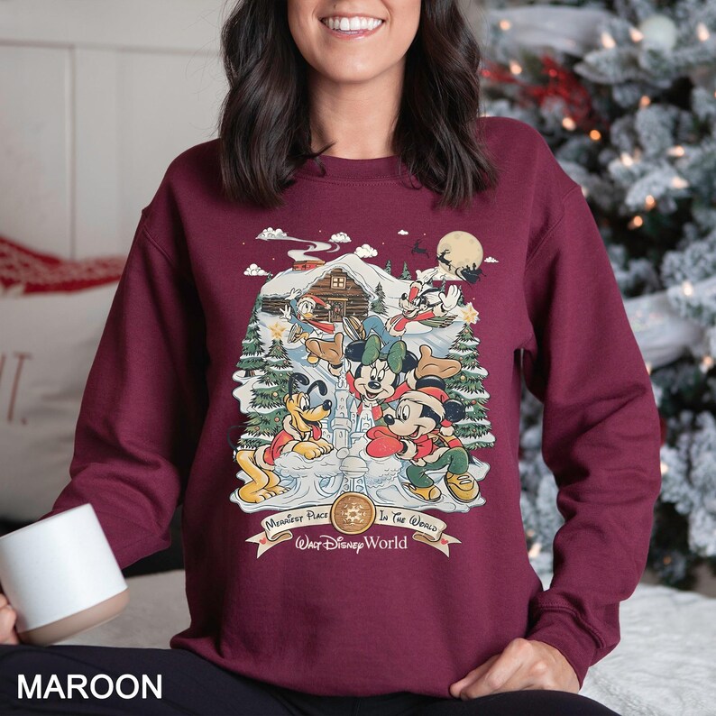 a woman sitting on a bed with a christmas tree in the background