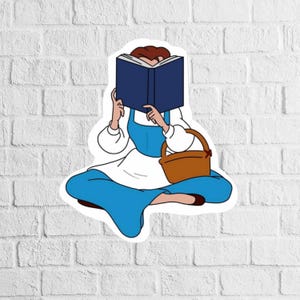 Puede incluir: Una ilustraci&oacute;n de dibujos animados de una mujer sentada con un libro que le cubre la cara. Lleva un vestido azul y un delantal blanco. Tiene una cesta marr&oacute;n en su regazo.