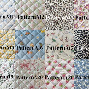 May include: A grid of twelve quilted fabric swatches labeled PatternA11 through PatternA22. The patterns include blue bows, floral prints, leopard spots, yellow sunflowers, cartoon animals, strawberries, and small blue blossoms on white or colored backgrounds.