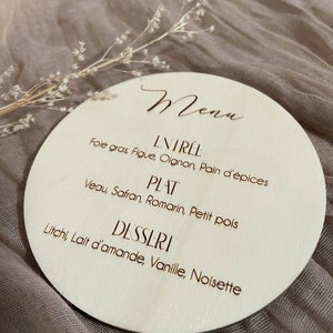 Round engraved wooden menu