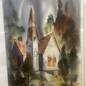 May include: Watercolour painting of a church with a tall steeple and a red roof, set against a moody, grey sky with a full moon. The church is surrounded by trees, creating a serene, vintage landscape scene.