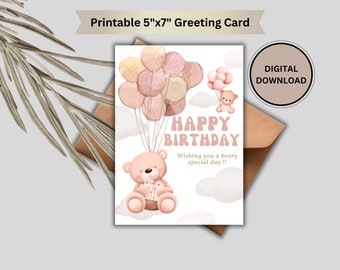 Peut inclure: Carte de vœux imprimable de 12,7x17,8 cm avec une illustration aquarelle de deux ours en peluche tenant des ballons. La carte dit "Joyeux anniversaire" et "Je vous souhaite une journée spéciale et oursine !"
