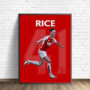 May include: A framed poster featuring a soccer player in a red and white uniform, with the name "RICE" at the top. The number "41" is prominently displayed. The background is a solid red color.
