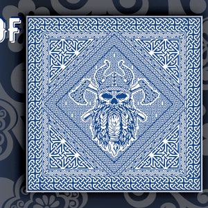May include: A white and blue geometric pattern with a skull in the centre wearing a crown. The skull has a beard and is surrounded by intricate designs.