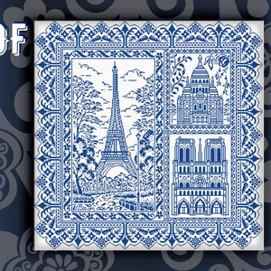 May include: A blue and white cross-stitch pattern featuring iconic Parisian landmarks, including the Eiffel Tower, Notre Dame Cathedral, and Sacré-Cœur Basilica. The pattern is framed with a decorative border.