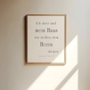 May include: A framed print with a white background and black text. The text reads "Ich aber und mein Haus wir wollen dem Herrn dienen Joshua 24:15".
