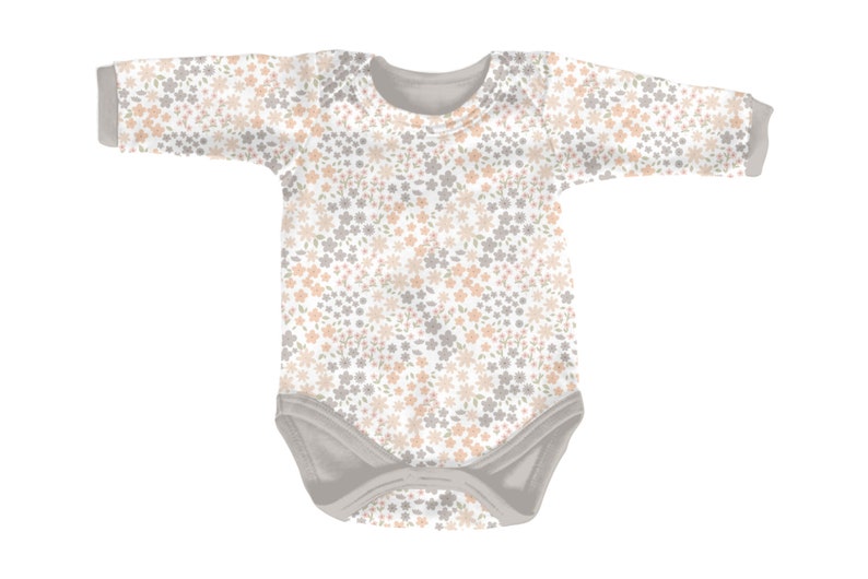 May include: A long-sleeve baby bodysuit featuring a repeating floral pattern in soft peach and muted gray tones against a white background. The garment includes a solid gray crew neckline, gray sleeve cuffs, and gray leg openings with snap closures.