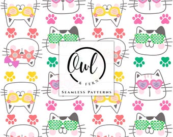 May include: A repeating pattern featuring white cat faces wearing various colorful sunglasses, including heart-shaped, star-shaped, and round frames. The design includes scattered pink, yellow, and green paw prints and a central logo reading Owl & Fern.