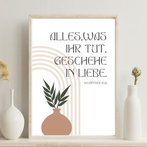 May include: A printable wall art print with a beige background and a vase with green leaves. The text reads "Alles, was ihr tut, geschehe in Liebe. 1.Korinther 16:14".