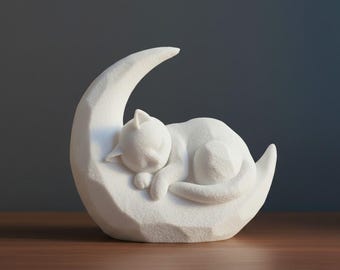 Sleeping kitten on a crescent moon