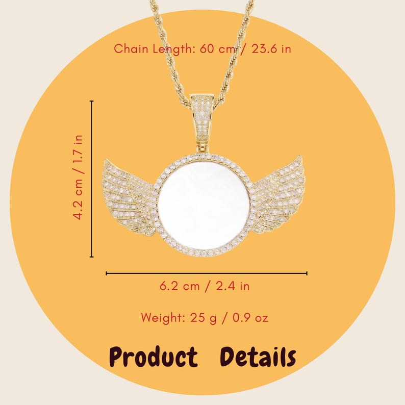 May include: A gold-toned pendant necklace featuring a circular center with wings on each side, encrusted with small clear stones. The chain length is 23.6 inches. The pendant measures 1.7 inches by 2.4 inches and weighs 0.9 ounces. Text reads Product Details.