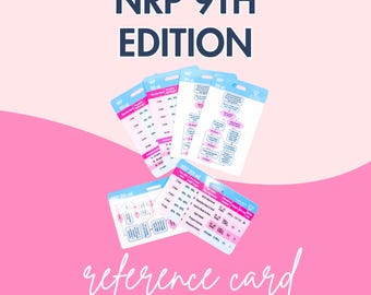 May include: A set of white reference cards for the NRP 9th Edition, featuring blue and pink accents with printed medical flowcharts, tables, and data. The cards are arranged in a fan-like display, showing various clinical guidelines and protocols.