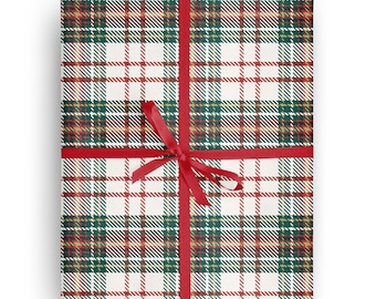 May include: Red and green plaid wrapping paper with a red ribbon tied in a bow.