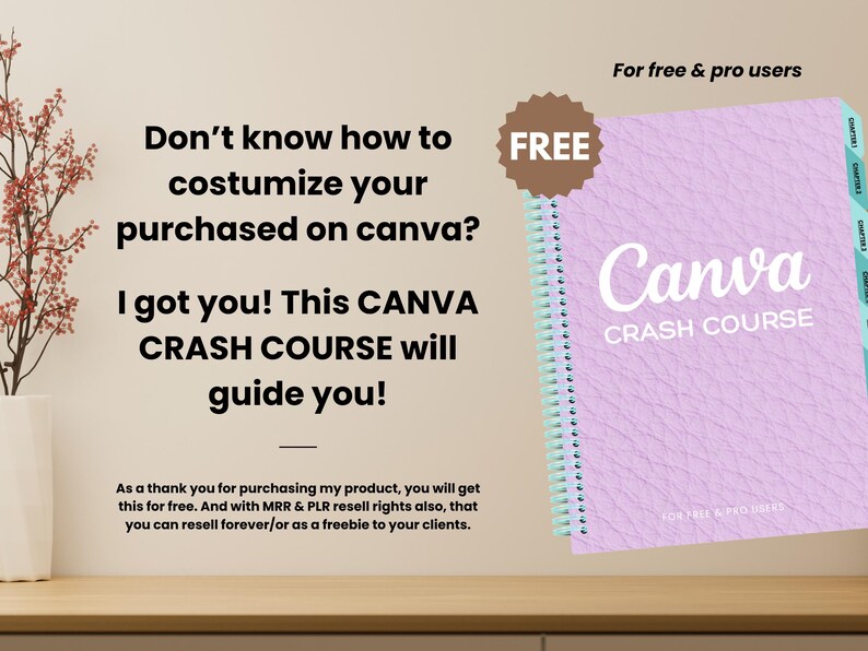 May include: A light purple spiral-bound notebook with the title "Canva Crash Course" in white. The cover has a textured design. The image includes the text "For free & pro users" and "FREE". The notebook is on a wooden surface.