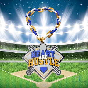 May include: A baseball-themed pendant with the words "Heart and Hustle" in blue and gold. The pendant hangs from a chain with gold, white, and blue links. The background shows a baseball stadium with bright lights.