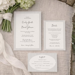 May include: Wedding invitation suite with striped design. Includes invitation, details card, and RSVP card. The invitation reads "Emely Smith and Daniel Johnson" with wedding details. A bouquet of white flowers and ribbon are in the background.