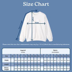 May include: A white sweatshirt with a size chart overlay. The chart displays measurements in inches and centimeters for width, length, and sleeve length, ranging from XS to 5XL. The text "Size Chart" is at the top.