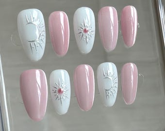 Handgeschilderde roze ovale nagels: roze cateye-chroomsterrenacrylaten