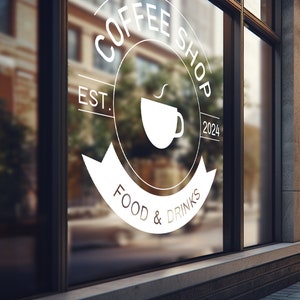 May include: A white sign on a glass storefront with the text "Coffee Shop Est. 2024 Food & Drinks" and a stylised coffee cup icon.