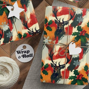 May include: Gift-wrapped presents with a deer and holly pattern, tied with twine and white tags. The wrapping paper features a watercolor design with red, orange, and green accents. A spool of twine, scissors, and a tag that says "Wrap & Roll" are also visible.