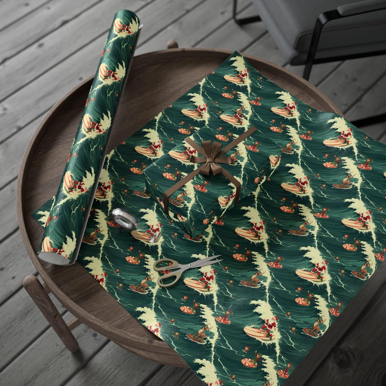 May include: A roll of wrapping paper and a gift box wrapped in the same paper, featuring a repeating pattern of Santa Claus surfing on waves against a dark green background. A brown ribbon is tied around the box, and metal scissors lie nearby.