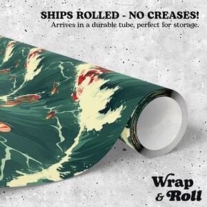 May include: A roll of wrapping paper featuring a dark green ocean scene with Santa Claus surfing on waves. The text SHIPS ROLLED - NO CREASES! Arrives in a durable tube, perfect for storage. is printed at the top, and Wrap & Roll is at the bottom.