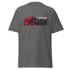 May include: A dark grey t-shirt with a red bear graphic and the text "ZR2 AEV" in white and black. The shirt is made of a soft material and has short sleeves.