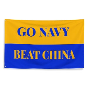 May include: A rectangular flag with a yellow upper half and a blue lower half. The words "GO NAVY" are in blue on the yellow section, and "BEAT CHINA" is in yellow on the blue section.