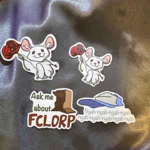 May include: Four stickers featuring a cartoon mouse holding a red poppy flower, a brown box with the text "Ask me about FCLORP", and a blue baseball cap with the text "Nyah-nyah-nyah-nyah nyah-nyah-nyah-nyah-nyah".