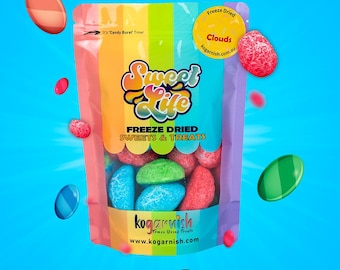 May include: A bag of freeze-dried sweets and treats called "Sweet Life" with a rainbow background. The bag contains colorful, freeze-dried fruit shaped candies. The bag has the text "Freeze Dried Sweets & Treats" and "kogarnish.com" printed on it.