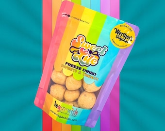 May include: A bag of freeze-dried Werther's Original candies. The bag is pink and purple with a rainbow design. The bag says "Sweet Life" and "Freeze Dried Sweets & Treats".