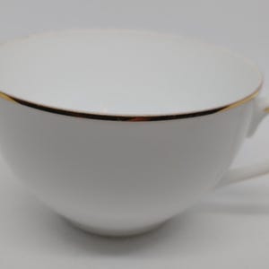 Taza de té Noritake de porcelana blanca y dorada, vintage, japonesa, en perfecto estado.