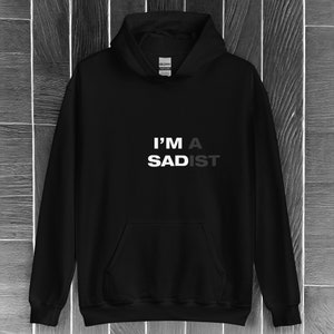 Hidden Message Unisex Hoodie: Embrace Your Authentic Self with the 'Revealing Sadism' Black Sweatshirt