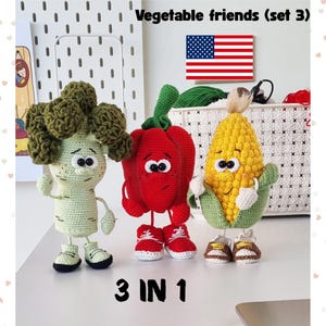 May include: Three crocheted vegetable figures: a broccoli, a red bell pepper, and an ear of corn. Each figure has a face and is wearing trainers. The text "Vegetable friends (set 3)" and "3 IN 1" are visible.