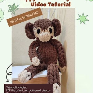 May include: A digital download pattern for crocheting a brown monkey plush toy. The pattern includes a PDF file with written instructions, photos, and a two-part video tutorial. The monkey is sitting on a wooden surface.