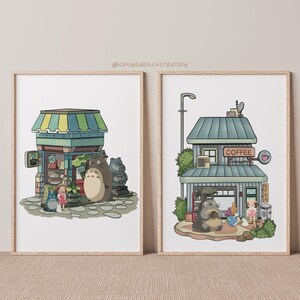 May include: Two framed art prints featuring whimsical illustrations. One depicts a shop with a green and yellow striped awning, and the other shows a coffee shop. Both prints feature cartoon characters and the text "@CHUNGAEILLUSTRATION".